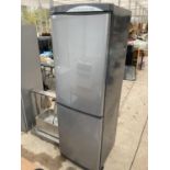 A SILVER DAEWOO UPRIGHT FRIDGE FREEZER BELIEVED IN WORKING ORDER BUT NO WARRANTY