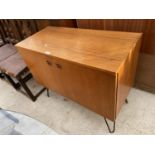 A RETRO TEAK TWO DOOR CABINET ON HAIRPIN LEGS, 36" WIDE