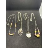 FOUR SILVER NECKLACES