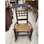 AN OAK ROCKING CHAIR WITH WOVEN SEAT