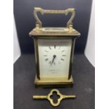 A GARRARD & CO LONDON BRASS CARRIAGE CLOCK WITH SWISS MOVEMENT IN WORKING ORDER WITH KEY