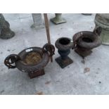 THREE CAST IRON GARDEN URNS