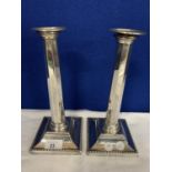 A PAIR OF HALLMARKED BIRMINGHAM 1923 SILVER CANDLESTICKS 22 TROY OZ