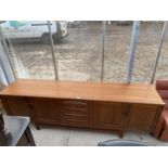 A G-PLAN 'FRESCO' TEAK SIDEBOARD, 84" WIDE, ENCLOSING FOUR CUPBOARDS AND FOUR DRAWERS