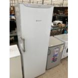 A WHITE HOTPOINT UPRIGHT FREEZER BELIEVED IN WORKING ORDER BUT NO WARRANTY