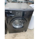 A BLACK BEKO 7KG WASHING MACHINE BELIEVED IN WORKING ORDER BUT NO WARRANTY