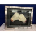 A FRAMED PAIR OF 1996 LENNOX LEWIS SIGNED BOXING GLOVES. NO COA