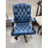 A 19TH CENTURY STYLE REVOLVING SWIVEL CHAIR WITH BUTTON BACK AND SEAT