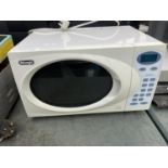 A WHITE DELONGHI MICROWAVE BALIEVED IN WORKING ORDER BUT NO WARRANTY