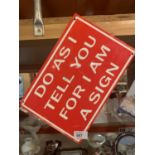 A METAL SIGN 'DO AS I TELL YOU FOR I AM A SIGN'