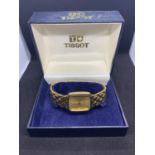 A BOXED TISSOTT STYLIST RETRO GOLD PLATED WRIST WATCH IN WORKING ORDER