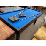 A MODERN POOL TABLE WITH BLUE CLOTH, SET OF BALLS, TWO CUES AND A TRIANGLE, 72x36" MAX