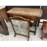 AN EARLY 20TH CENTURY OVAL OAK GATELEG TABLE ON BARLEYTWIST LEGS TOGETHER WITH A TAPESTRY FIRE