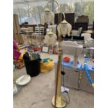 A BRASS THREE ARM FLOOR LAMP WITH GLASS FLOWER HEAD STYLE SHADES BELIEVED IN WORKING ORDER BUT NO