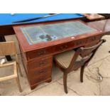 A MODERN YEW WOOD TWIN PEDESTAL DESK WITH INSET LEATHER TOP ENCLOSING NINE DRAWERS, 48x24" AND ONE