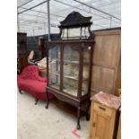 AN ART NOUVEAU MAHOGANY TWO DOOR DISPLAY CABINET WITH MIRROR BACK ON AN OPEN BASE WITH CABRIOLE