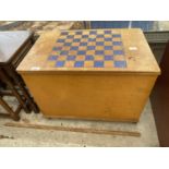 A VINTAGE TOY BOX WITH CHESS TABLE TOP