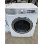 A SILVER AND WHITE AEG WASHING MACHINE BELIEVED IN WORKING ORDER BUT NO WARRANTY