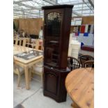 A MAHOGANY CORNER CABINET WITH LOWER DOOR AND UPPER GLAZED DOOR