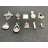 TEN SILVER PENDANTS