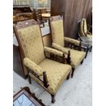 A PAIR OF LATE VICTORIAN OAK FRAMED FIRESIDE CHAIRS