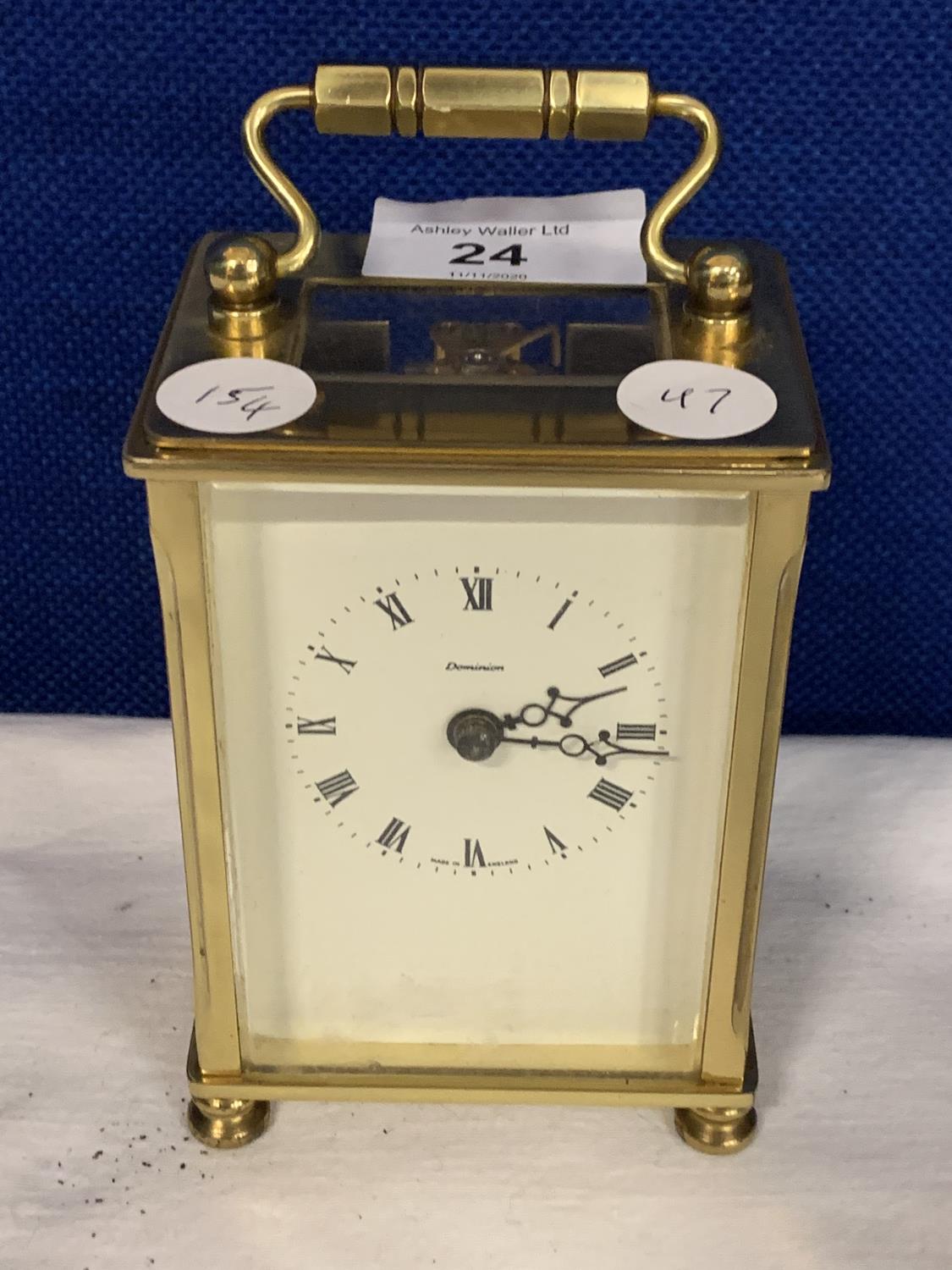 A VINTAGE BRASS CARRIAGE CLOCK WITH VISUAL MOVEMENTS