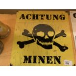 AN ACHTUNG MINEN METAL MAN CAVE SIGN