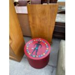 A CIRCULAR OCCASIONAL TABLE IN THE FORM OF A HAT BOX, WITH TRIBAL DECORATION TO THE LID, 20.5"