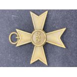 A BRASS MEDAL WITH SWASTIKA AND 1939 TO REVERSE