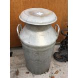A VINTAGE 10 GALLON MILK CHURN IN VERY GOOD CONDITION