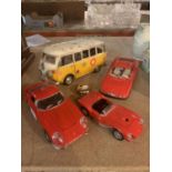 THREE MODEL RED FERRARIS AND A MODEL DECORATIVE CAMPER VAN