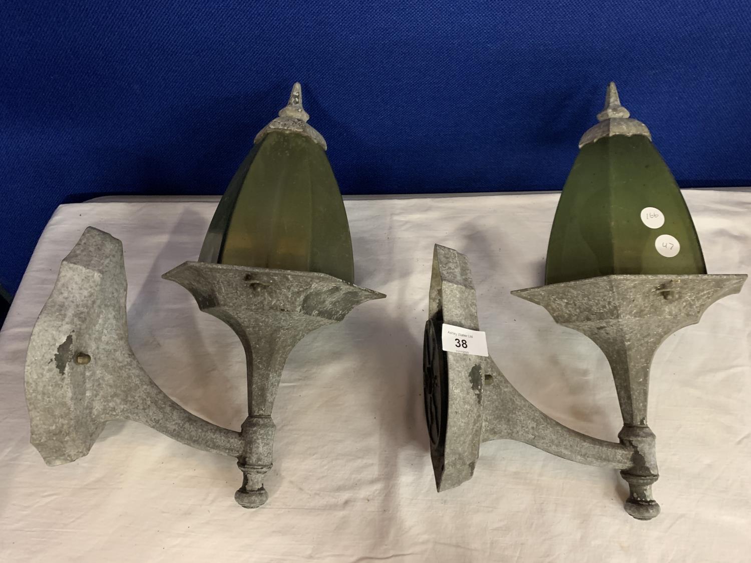 A VINTAGE PAIR OF METAL AND GREEN EXTERIOR LIGHTS