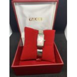 A BOXED LADIES WRIST WATCH WITH PINK RECTANGULAR FACE AND WHITE METAL STRAP IN WORKING ORDER