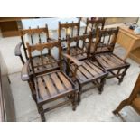 A SET OF SIX ERCOL DINING CHAIRS WITH TRIPLE ARCHED AND TURNED BACKS AND SLATTED SEATS (2 CHAIRS