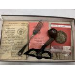 A COLLECTION OF WWI/WWII ITEMS TO INCLUDE UNIFORM BADGES, RATION BOOKS, NAAFI FORK AND A PIPE