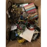 A LARGE QUANTITY OF COSTUME JEWELLERY TO INCLUDE BOXES