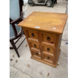 A SMALL MEXICAN PINE CHEST OF SIX DRAWERS