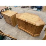 A TELEVISION STAND AND A CHEST OF DRAWERS