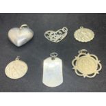 SIX VARIOUS SILVER PENDANTS