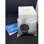 A NEW BOXED LORUS CALENDAR WRIST WATCH IN WORKING ORDER