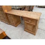 A MDOERN PINE KNEEHOLE DESK ENCLOSING TWO DRAWERS AND TWO CUPBOARDS, 54" WIDE