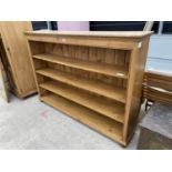 A LARGE PINE OPEN BOOKCASE, 72 INCHES WIDE