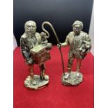 TWO SILVER PLATED FIGURINES DEPICTING A SHEPHERD AND AN ORGAN GRINDER WITH MONKEY