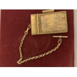 A VINTAGE BRASS NOTEPAD AND CHAIN