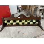 A TILED OAK WASHSTAND SPLASHBACK