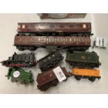 A COLLECTION OF HORNBY ENGINE, CARRIAGES AND SEVERAL TRUCKS