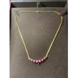 A BEAVERBROOKS 18 CARAT GOLD DIAMOND AND RUBY NECKLACE IN A PRESENTATION BOX LENGTH APRROX 42CM