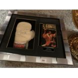 A FRAMED AND SIGNED JOHN CONTEH BOXING GLOVE TO INCLUDE AN AUTOBIOGRAPHY. NO COA