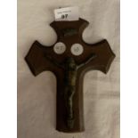 AN ORNATE WOODEN AND METAL CRUCIFIX