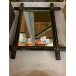 A VINTAGE VICTORIAN CROSS CORNERS MIRROR